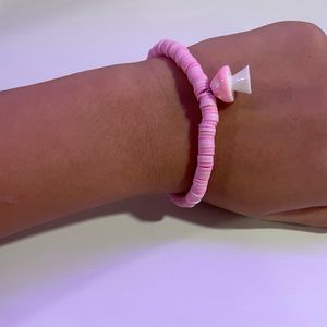 Pink stretchy bracelet with cute little pink mushroom